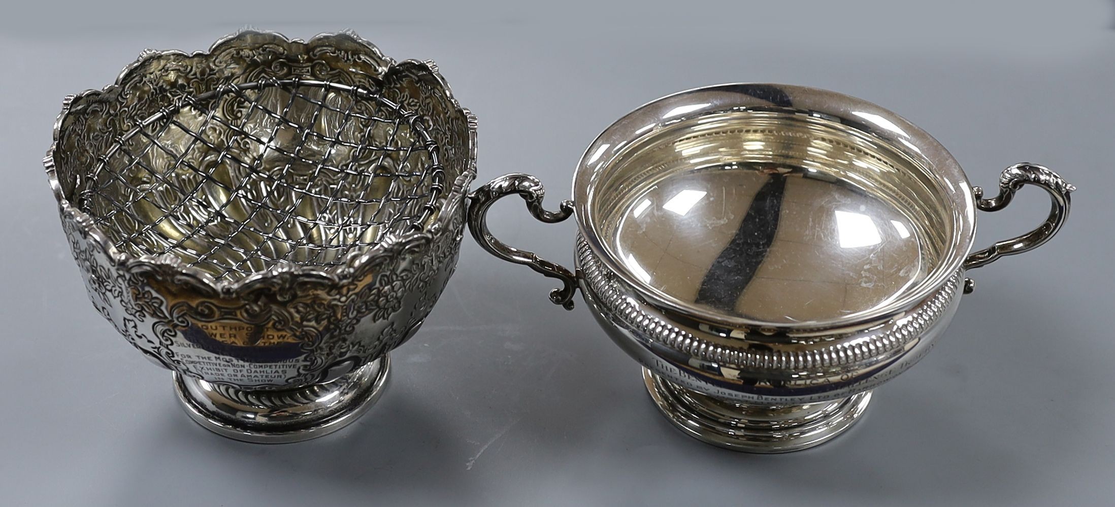 A George V silver small rose bowl, Birmingham, 1913, diameter 12.8cm and a later silver two handled bowl, gross 14.5oz.